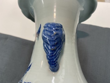 A Chinese blue, white and copper red vase with elephant handles, 19th C.